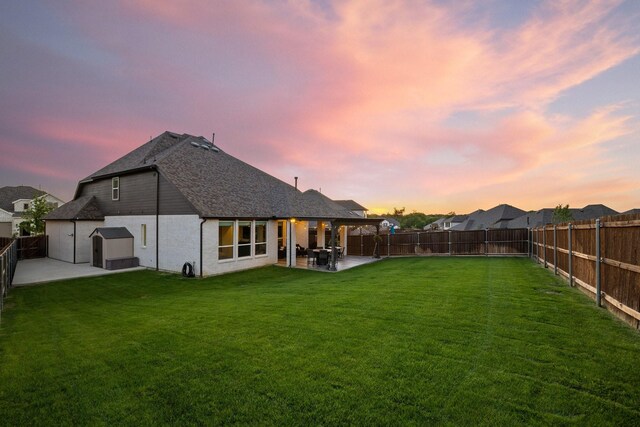 507 N Eagle Point Rd, Van Alstyne, TX 75495 - back of house with a shed, a patio, an outbuilding, and a shingled roof