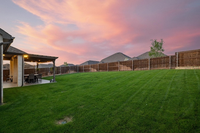 507 N Eagle Point Rd, Van Alstyne, TX 75495 - yard at dusk featuring a patio