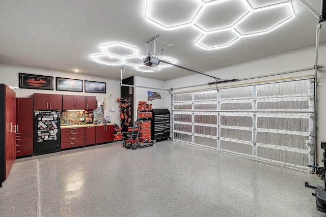 507 N Eagle Point Rd, Van Alstyne, TX 75495 - garage featuring a garage door opener and refrigerator
