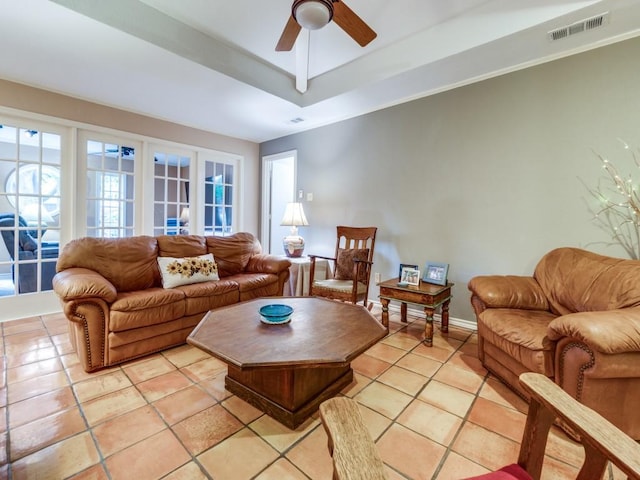 12151 Crestline Ave, Dallas, TX 75244 - living area with ceiling fan, light tile patterned floors, a tray ceiling, and french doors