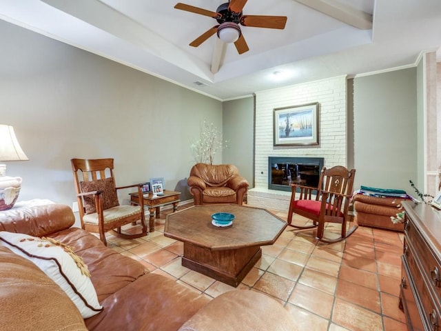 12151 Crestline Ave, Dallas, TX 75244 - living room with a tray ceiling, a fireplace, a ceiling fan, light tile patterned floors, and ornamental molding