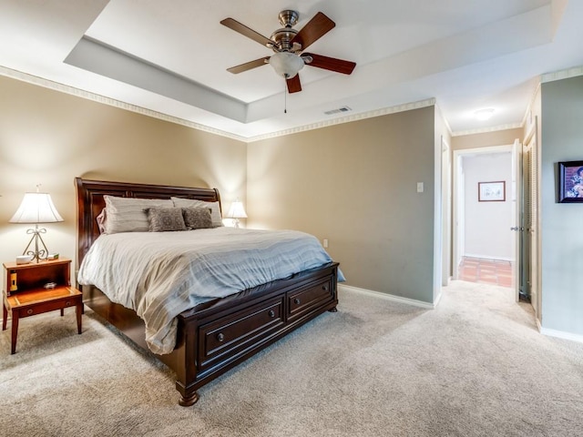 12151 Crestline Ave, Dallas, TX 75244 - carpeted bedroom featuring a tray ceiling, baseboards, ornamental molding, and ceiling fan