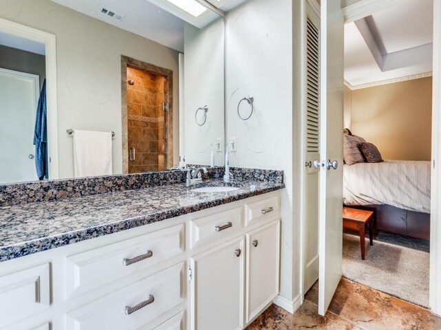 12151 Crestline Ave, Dallas, TX 75244 - full bathroom with connected bathroom, vanity, and tiled shower
