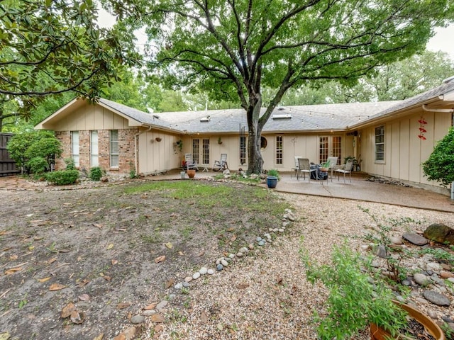 12151 Crestline Ave, Dallas, TX 75244 - back of house featuring a patio area, fence, board and batten siding, and french doors