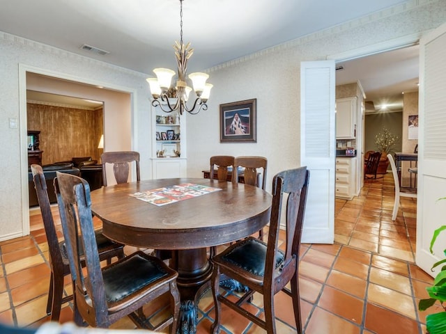 12151 Crestline Ave, Dallas, TX 75244 - dining area featuring light tile patterned floors, a chandelier, and built in features
