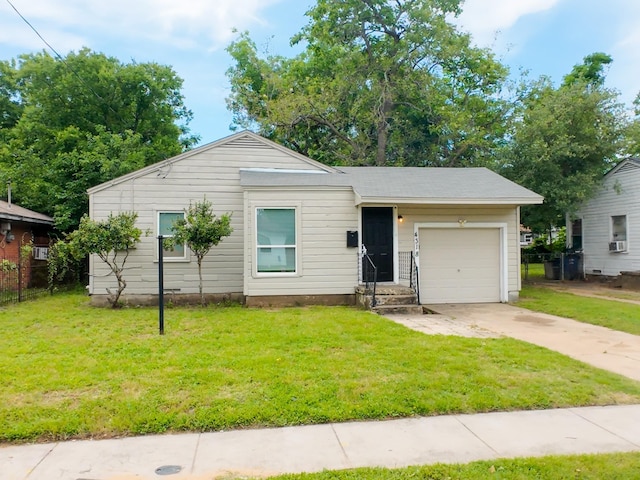 4318 York St, Dallas, TX 75210 - ranch-style house with driveway, an attached garage, and a front yard