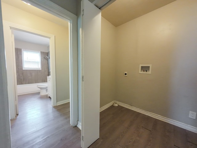 4318 York St, Dallas, TX 75210 - laundry area with electric dryer hookup, washer hookup, wood finished floors, and baseboards