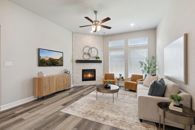 2415 Preakness Pl, Celina, TX 75009 - living area featuring ceiling fan, wood finished floors, a fireplace, baseboards, and recessed lighting