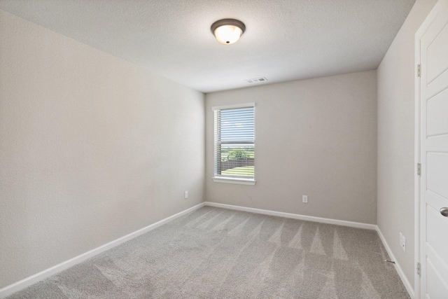 2415 Preakness Pl, Celina, TX 75009 - spare room featuring light colored carpet, baseboards, and a textured ceiling