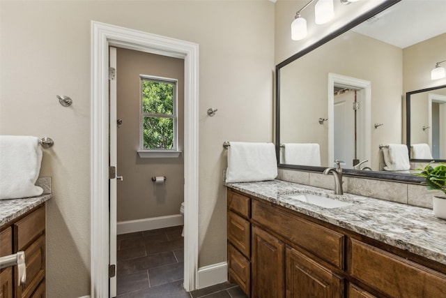 410 W Estelle Ln, Lucas, TX 75002 - bathroom with toilet, vanity, baseboards, and tile patterned floors