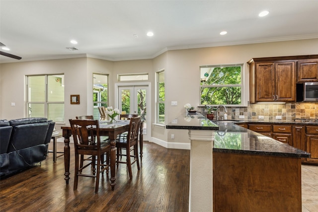 410 W Estelle Ln, Lucas, TX 75002 - dining area with plenty of natural light, dark wood finished floors, ornamental molding, recessed lighting, and french doors
