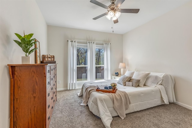3932 Oak Creek Cir, Denison, TX 75020 - carpeted bedroom with baseboards and a ceiling fan