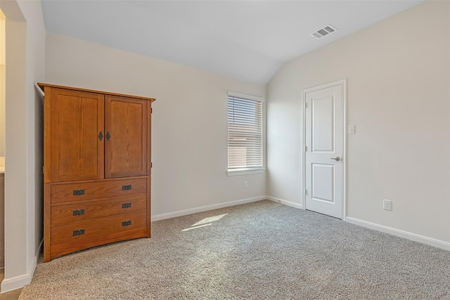 3932 Oak Creek Cir, Denison, TX 75020 - unfurnished bedroom with light colored carpet, vaulted ceiling, and baseboards