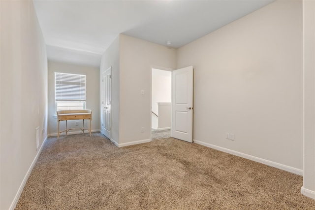 3932 Oak Creek Cir, Denison, TX 75020 - unfurnished bedroom with carpet flooring and baseboards