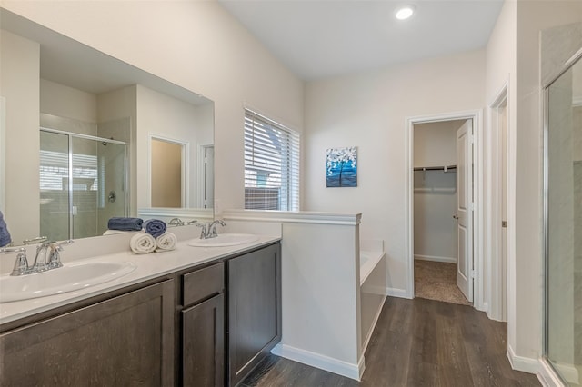 3932 Oak Creek Cir, Denison, TX 75020 - full bathroom featuring a shower stall, wood finished floors, and a bath