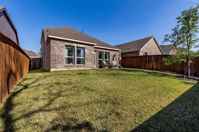 3932 Oak Creek Cir, Denison, TX 75020 - back of house featuring brick siding