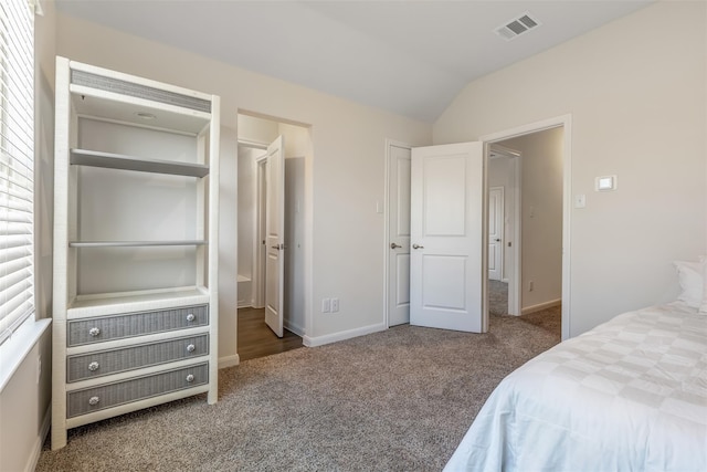 3932 Oak Creek Cir, Denison, TX 75020 - carpeted bedroom featuring vaulted ceiling and baseboards