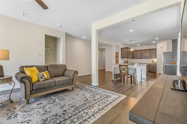 3932 Oak Creek Cir, Denison, TX 75020 - living area featuring dark wood finished floors, baseboards, recessed lighting, and ceiling fan