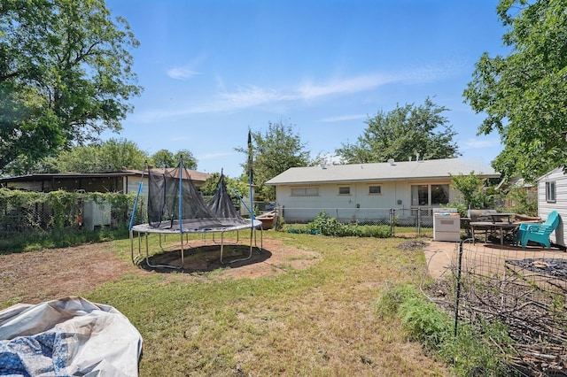 view of yard featuring a trampoline