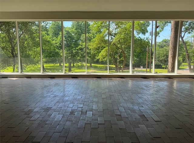 1934 Kessler Pkwy, Dallas, TX 75208 - unfurnished sunroom featuring view of wooded area