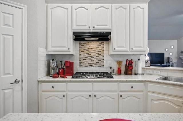 2813 Calico Rock Dr, Fort Worth, TX 76131 - kitchen featuring extractor fan, stainless steel gas cooktop, decorative backsplash, and white cabinetry