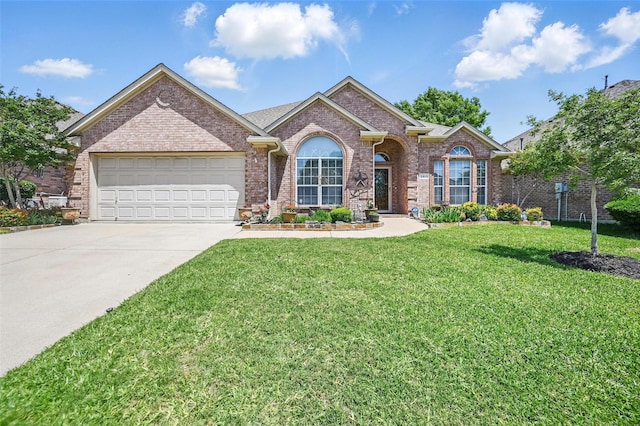 2813 Calico Rock Dr, Fort Worth, TX 76131 - view of front of house with driveway, brick siding, a garage, and a front yard