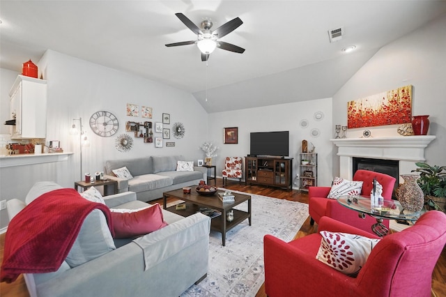 2813 Calico Rock Dr, Fort Worth, TX 76131 - living area featuring vaulted ceiling, wood finished floors, a ceiling fan, a glass covered fireplace, and recessed lighting