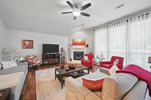 2813 Calico Rock Dr, Fort Worth, TX 76131 - living room with ceiling fan, vaulted ceiling, a glass covered fireplace, and dark wood-style flooring