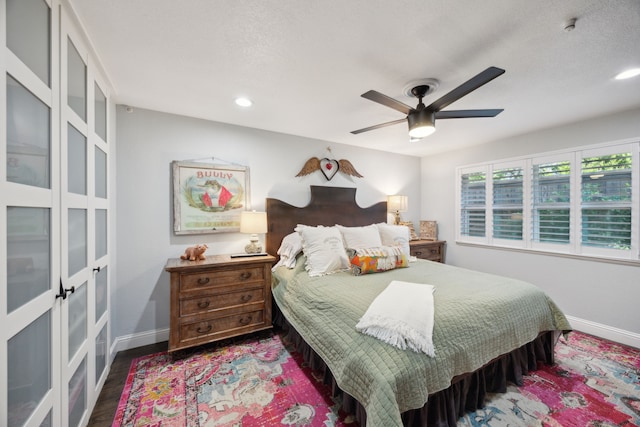 8538 Grenadier Dr, Dallas, TX 75238 - bedroom featuring baseboards, a ceiling fan, recessed lighting, wood finished floors, and french doors