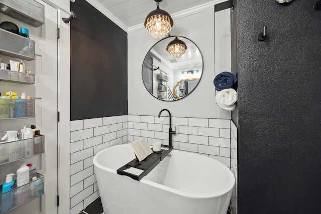 8538 Grenadier Dr, Dallas, TX 75238 - full bathroom with a chandelier, tile walls, a soaking tub, ornamental molding, and wainscoting