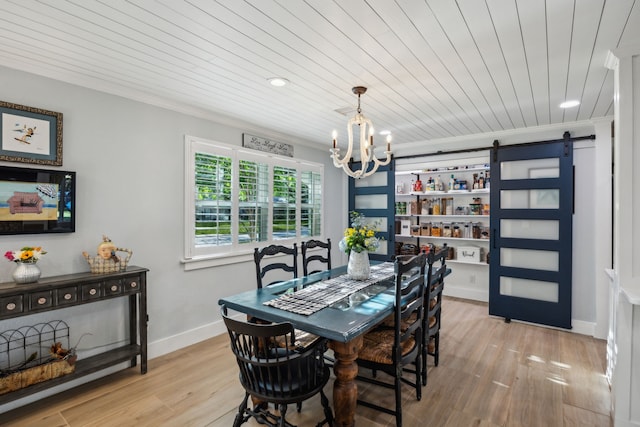 8538 Grenadier Dr, Dallas, TX 75238 - dining area featuring a barn door, a chandelier, light wood-style flooring, wooden ceiling, and recessed lighting