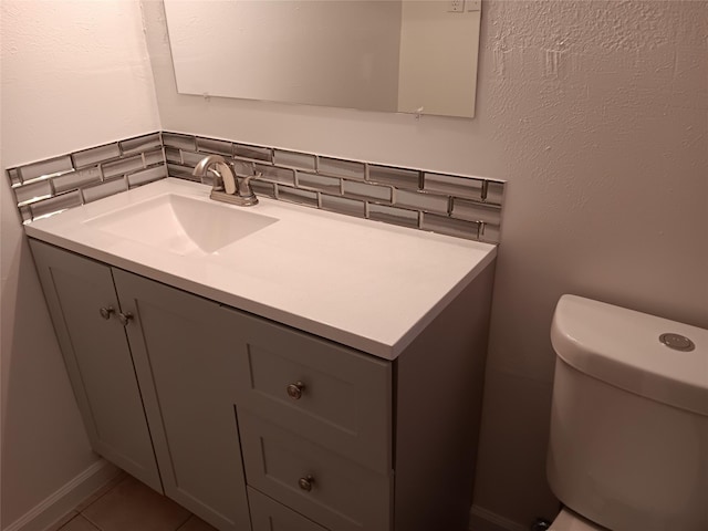 12249 High Pointe Cir, Dallas, TX 75243 - bathroom with vanity, toilet, decorative backsplash, and tile patterned flooring