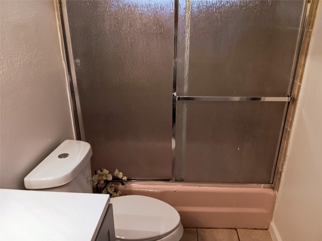 12249 High Pointe Cir, Dallas, TX 75243 - full bathroom with toilet, tile patterned flooring, vanity, and bath / shower combo with glass door