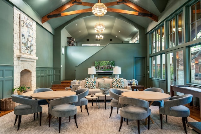 4710 Bobbitt Dr, Dallas, TX 75229 - dining area featuring a fireplace, a chandelier, high vaulted ceiling, recessed lighting, and beam ceiling