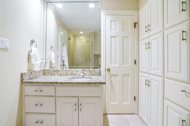 4710 Bobbitt Dr, Dallas, TX 75229 - bathroom featuring vanity, a shower stall, tile patterned floors, and recessed lighting