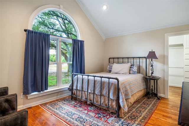 4710 Bobbitt Dr, Dallas, TX 75229 - bedroom featuring wood finished floors, vaulted ceiling, ornamental molding, baseboards, and recessed lighting