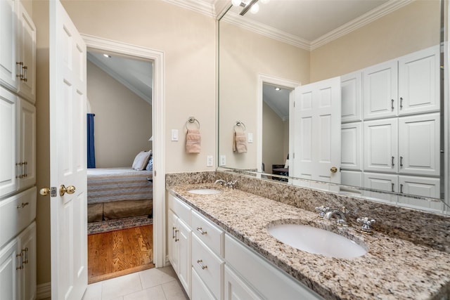 4710 Bobbitt Dr, Dallas, TX 75229 - ensuite bathroom with crown molding, double vanity, and tile patterned flooring