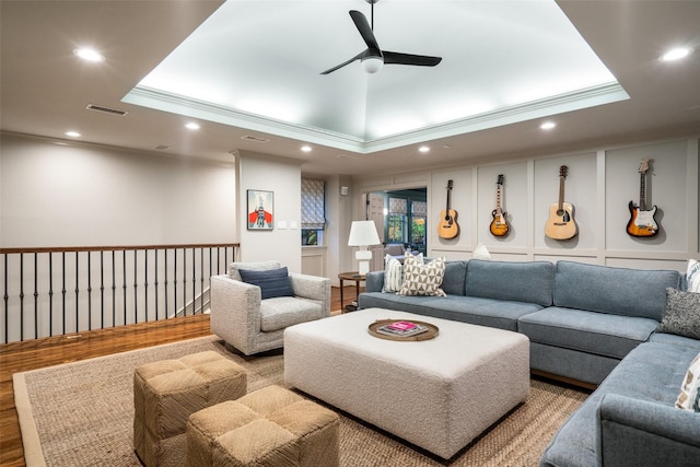 4710 Bobbitt Dr, Dallas, TX 75229 - living area with ornamental molding, a tray ceiling, a ceiling fan, recessed lighting, and wood finished floors