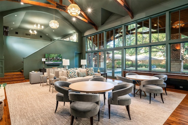 4710 Bobbitt Dr, Dallas, TX 75229 - dining area with a chandelier, high vaulted ceiling, wood finished floors, beam ceiling, and recessed lighting