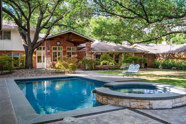 4710 Bobbitt Dr, Dallas, TX 75229 - view of swimming pool featuring a pool with connected hot tub and a patio
