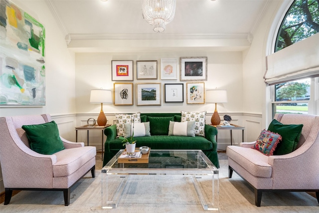 4710 Bobbitt Dr, Dallas, TX 75229 - living area featuring ornamental molding, a decorative wall, wainscoting, a chandelier, and wood finished floors