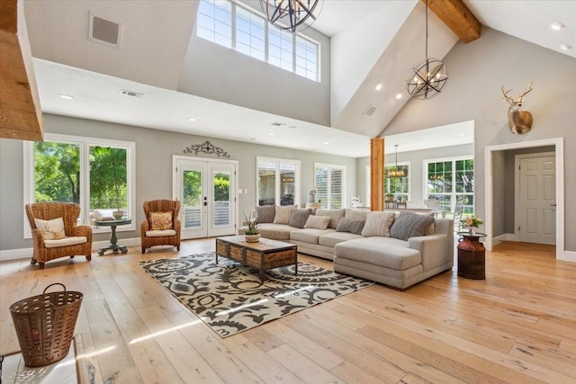 1345 Stillwater Rd, Waco, TX 76708 - living area with a chandelier, wood-type flooring, high vaulted ceiling, beamed ceiling, and recessed lighting