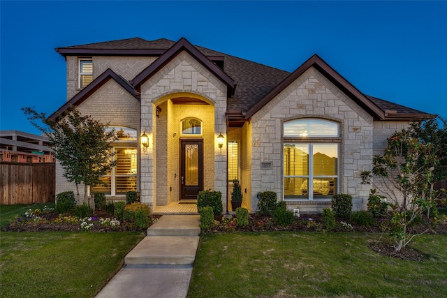 12523 Royal Oaks Ln, Farmers Branch, TX 75234 - french provincial home with stone siding, a shingled roof, and brick siding