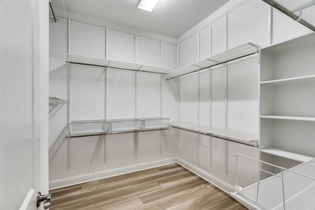 12523 Royal Oaks Ln, Farmers Branch, TX 75234 - walk in closet featuring wood finished floors