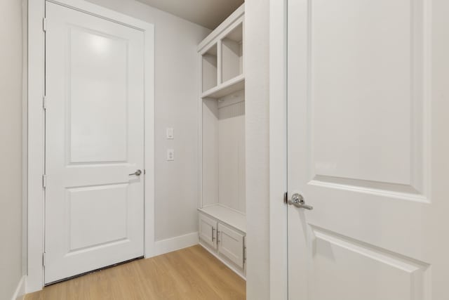 8289 Emsworth Dr, Dallas, TX 75231 - mudroom with light wood finished floors and baseboards