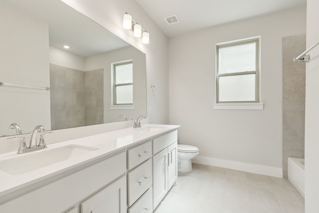 8289 Emsworth Dr, Dallas, TX 75231 - bathroom with baseboards, toilet, double vanity, and recessed lighting