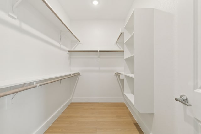 8289 Emsworth Dr, Dallas, TX 75231 - spacious closet with light wood-style flooring