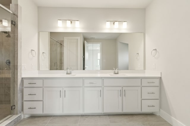 8289 Emsworth Dr, Dallas, TX 75231 - bathroom with double vanity, a shower stall, baseboards, and tile patterned flooring