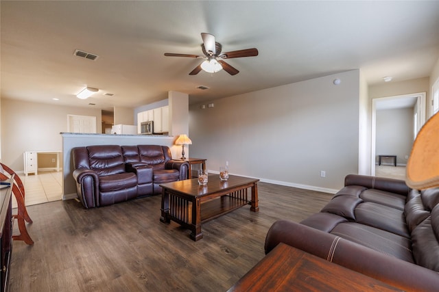 1431 Puerto Lago Dr, Little Elm, TX 75068 - living room with a ceiling fan, dark wood-style flooring, and baseboards