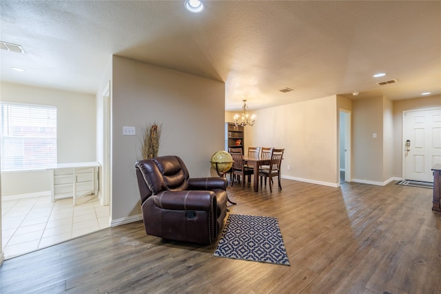 1431 Puerto Lago Dr, Little Elm, TX 75068 - living area with a chandelier, wood finished floors, recessed lighting, baseboards, and a textured ceiling